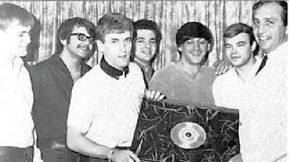 Tommy James and the Shondells -- Ron Rosman, left, George Magura, Tommy James, Vinnie Pietropoli, Mike Vale and Joe Kessler -- receive their first gold record for "Hanky Panky" from Morris Levy in 1966.