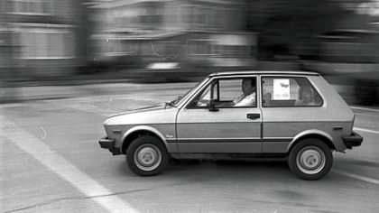 An unidentified man test drives a Yugo on the streets of Brockton, Mass. in this Aug. 27, 1985 photo.