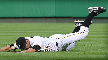 Pirates right fielder Garrett Jones is unable to come up with this single by the Cubs' Alfonso Soriano.