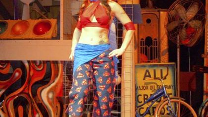 Amethyst models a bellydance costume with a Superman theme created by cartoon artist Marcel Walker.