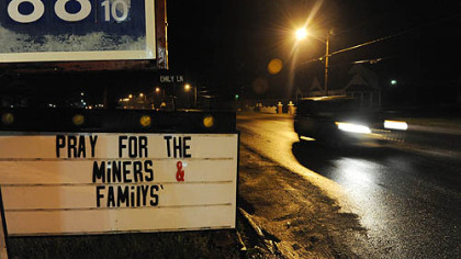 A sign outside of a gas station along Route 3 asks passersby to pray for the families of the miners caught in Massey Energy's Upper Big Branch mine explosion there killed at least 25 people, Monday.