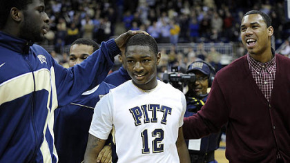 Pitt's Ashton Gibbs is congratulated by teammates.