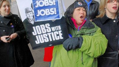 Maria Somma, center, a representative of United Steelworkers, chants We Want Jobs at a rally held Feb. 5 in the portico of Pittsburgh's City-County Building. Extensions of unemployment benefits are set to expire Feb. 28.