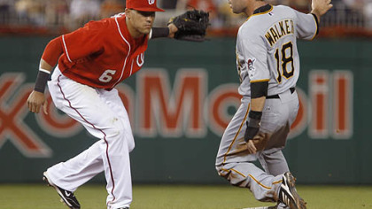 The Pirates' Neil Walker steals second base as Nationals shortstop Ian Desmond makes a late tag during the sixth inning.