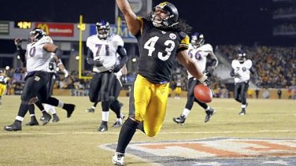 The Steelers' Troy Polamalu crosses the endzone after intercepting a ball against the Ravens late in the fourth quarter of the AFC Championship at Heinz Field Sunday. The win, in a particularly violent game, sent the Steelers to Super Bowl XLIII.