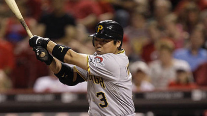 The Pirates' Akinori Iwamura hits a pinch-hit single off Reds relief pitcher Enerio Del Rosario to drive in a run in the seventh inning.