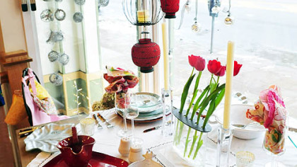 Kitchen decorations and dining utensils are arranged on a table display inside the Annex Cookery store in Homestead.