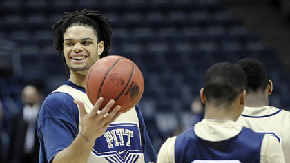 Pitt's Gary McGhee, left, plays with a ball during practice.