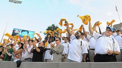 Art Rooney II, Mike Tomlin and Kevin Colbert lead the Steelers as they cheer for LeBeau in the stands in Canton.