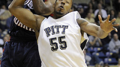 Pitt forward J.J. Richardson and Robert Morris'' guard Velton Jones collide as they go for a rebound in the first half.