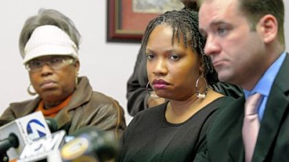 Terez Miles, center, mother of Jordan Miles, who was beaten by three police officers in Homewood, listens during a news conference held by the NAACP on Wednesday. At left is her mother, Patricia Porter, and, at right, her attorney John K. Lewis.
