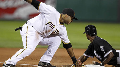 Pirates third  baseman Pedro Alvarez can''t handle the throw from catcher Ryan Doumit as the White Sox's Juan Pierre steals third in the ninth inning.