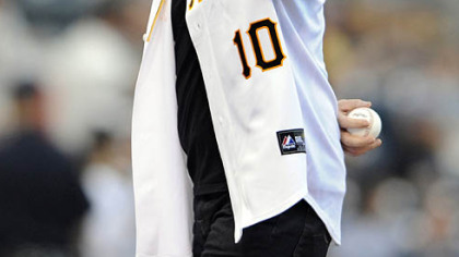Singer George Thorogood acknowledges the crowd before he throws out the first pitch before the game againt the Rockies Saturday night at PNC Park.