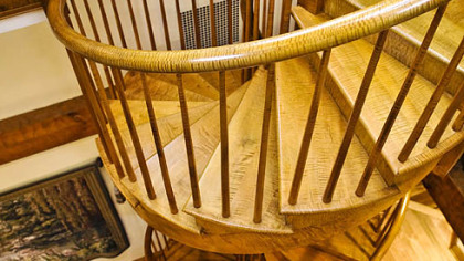 Looking down the handcrafted spiral staircase from the fourth floor.