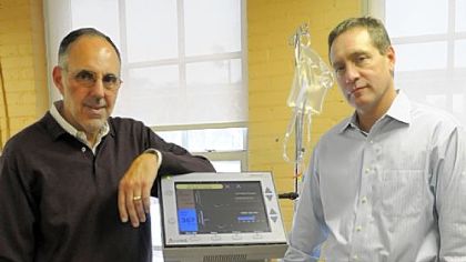 Pete DeComo, chief executive officer, and Nick Kuhn, chief operating officer of ALung, show off their HemoLung respiratory-assist device that works as an artificial lung for medical patients.
