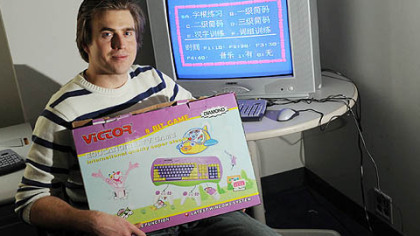 Carnegie Mellon University graduate student Derek Lomas holds a cheap, low-powered computer he purchased in India. He's co-founder of a nonprofit that is creating educational software featuring games that can be used on this type of computer == games that will be given away in developing nations.