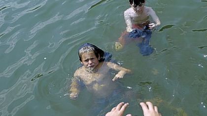 Ryan Lynch, 10, at bottom of photo, a member of Troop 215 in Bethel Park, helps fellow troop member Patrick Counihan, 11, center, and Ben Smith, 11, top, of Troop 510 in South Park, work on a swimming merit badge.
