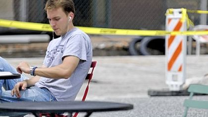 Bojan Popovic, 26, of Aliquippa, is listening to music while studying. He is considering purchasing custom earbuds to filter out background noise.