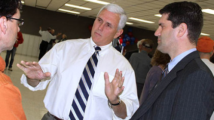 Indiana Congressman Mike Pence, center, makes a point while campaigning on behalf of Republican nominee Tim Burns, right, during a stop Monday in suburban Johnstown. Mr. Burns has enjoyed an upswing in the polls in his quest to succeed the late U.S. Rep. John P. Murtha.