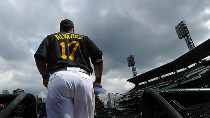 The Pirates' Pedro Alvarez makes his way to the field during batting practice.
