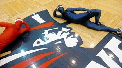 Red Man and Blue Man: Passionate (and colorful) fans of Duquesne basketball.