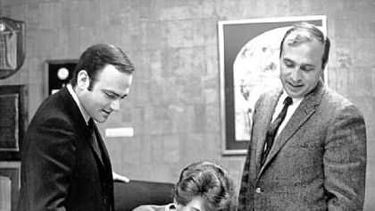 Tommy James, center, signs his Roulette contract with his manager, Lenny Stogel, left, and Morris Levy, head of the record label.