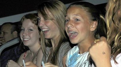 Front-row fans react to actor Taylor Lautner, star of the movie "The Twilight Saga: Eclipse" who made an unannounced appearance at the AMC-Loews at The Waterfront before a screening of the film Saturday night.