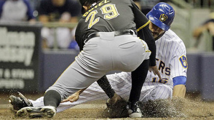 Pirates closer Octavio Dotel tags out the Brewers' George Kottaras at home in the ninth inning Friday.