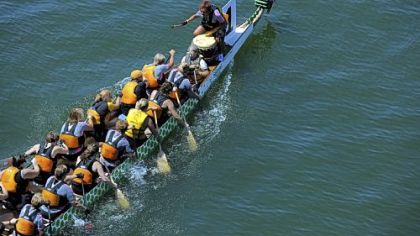 The Women of Steel dragon boat team takes first place Saturday in the 500-meter premier women's race during the Three Rivers Regatta.