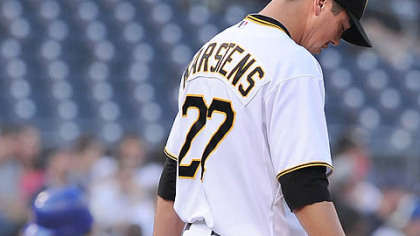 The Cubs' Xavier Nady rounds the bases past Pirates pitcher Jeff Karstens after hitting a two-run homer in the third inning.