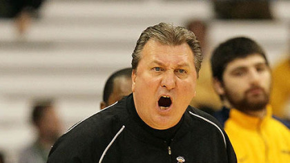 West Virgnia head coach Bob Huggins yells in the first half.