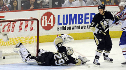 Penguins goaltender Marc-Andre Fleury watches as the Canadiens' third goal goes in the net in the second period of Wednesday's game at Mellon Arena.