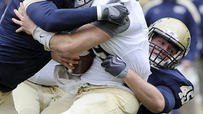 Tyrone Ezell and Tyler Tkach sack quarterback Pat Bostick.