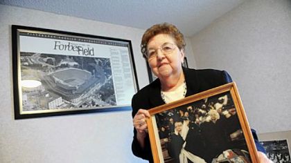 Alberta Shermann, 80, holds some of the memorablilia from her four decades as a season-ticket holder. She decided not to renew her plan this season. "They've killed something in me, and I'm done," she said.