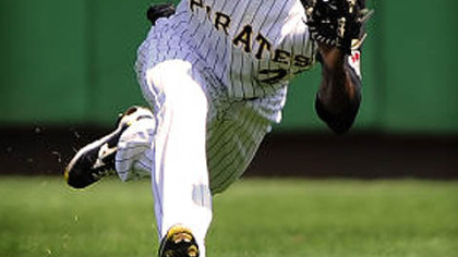 Pirates center fielder Andrew McCutchen makes a diving catch on ball hit by the Astros Pedro Feliz during Sunday's game at PNC Park. McCutchen was injured on the play.