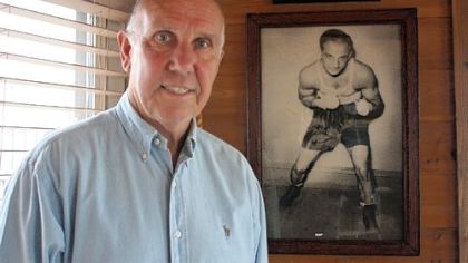 Bernie Marino, an Irwin resident, stands in front of a photo of his uncle, Tony Marino, who was a world champion boxer in the 1930s.