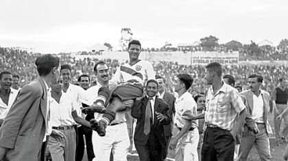 In this June 28, 1950 file photo, Joe Gaetjens is carried off by cheering fans after his U.S. soccer team beat England 1-0 in a World Cup soccer match that still stands as one of sports' greatest upsets.