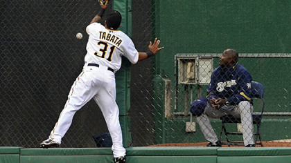 Pirates outfielder Jose Tabata leaps for a home run ball hit by the Brewers' Jim Edmonds in the third inning.