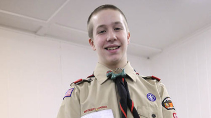Mike Behme, 15, distributes ball caps and hats to clients at the West Allegheny Food Bank in North Fayette for his Eagle Scout project. Behme collected hats tossed onto the ice after the Penguins' Sidney Crosby, Evgeni Malkin and Chris Kunitz scored hat tricks in games this year.
