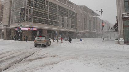Snow falls on the Verizon Center in Washington today, roughly 24 hours before tomorrow's Penguins-Capitals game.