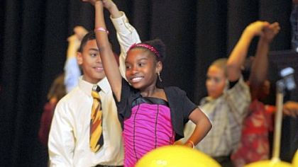 Chanel Curges and her partner Dondre Hall have fun dancing and twirling.