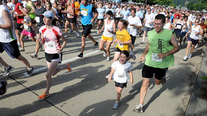 Runners take off for the 5k run in the 8th Annual Father's Day 5k/10k Run and Walk for Prostate Cancer on Sunday.