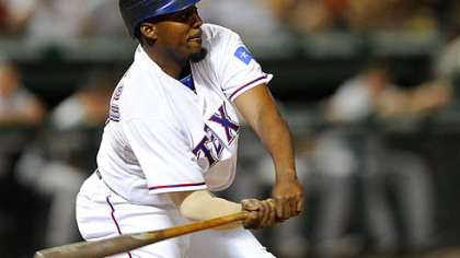The Rangers' Vladimir Guerrero swings for a pitch from Pirates pitcher Steven Jackson in the ninth inning. Guerrero singled home the winning run with two outs in the ninth inning.
