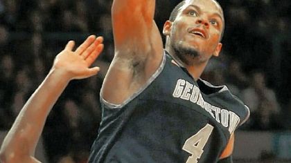 Georgetown's Chris Wright dunks on  West Virginia's Kevin Jones.