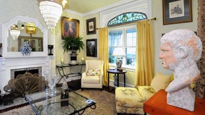 Larry Crouser and John Bratton had to find new fireplace mantels and do major restoration in the living room of their home on Fleming Avenue.
