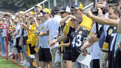 Steelers fans line up to watch their team during the first day of training camp in Latrobe Saturday.