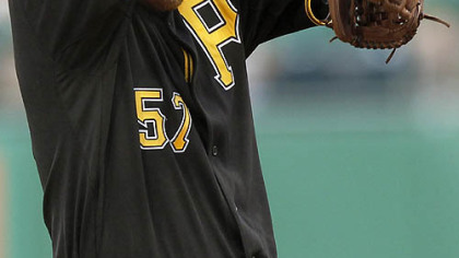 Pirates pitcher Zach Duke wipes his face after giving up a single to the Nationals' Michael Morse during the sixth inning.