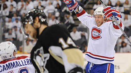 Canadiens forwards Andrei Kostitsyn and Mike Cammalleri celebrates a second period goal in front of Penguins forward Chris Kunitz during Wednesday's game at Mellon Arena.