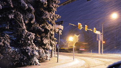 The big snow starts in earnest Friday night, as a snow plow as well as traffic slowly makes it way along Freedom Road in Cranberry Township.