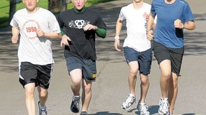 Seminarians, from left, William Wuenschel, Benjamin Cahill, Anthony Sciarappa and Patrick Caruso will be running in Sunday's Pittsburgh Marathon to raise money for people who need to pay college loans before joining religious orders and taking vows of poverty.